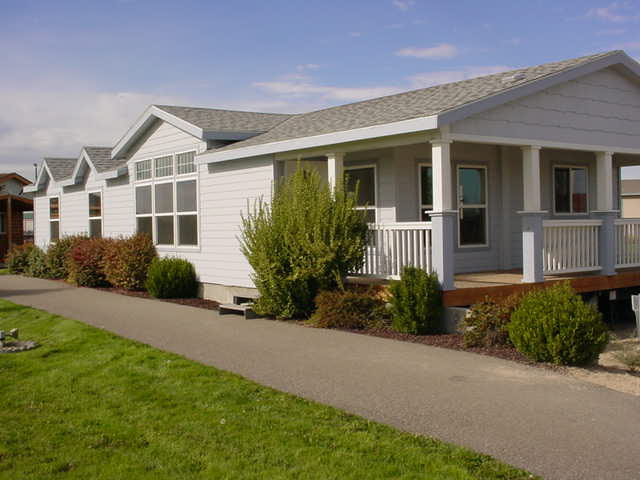 A photo of a manufactured home in a community setting
