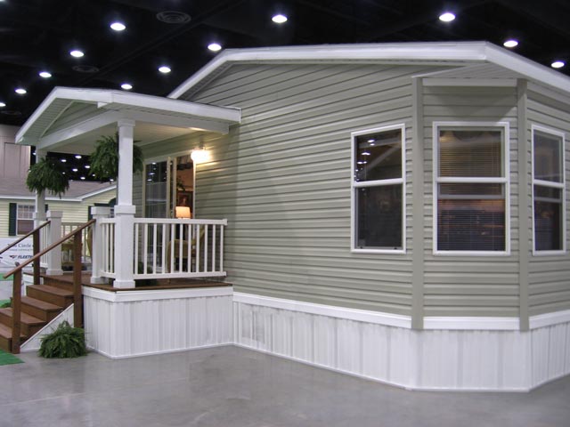 A photo of a manufactured home on display at a trade show