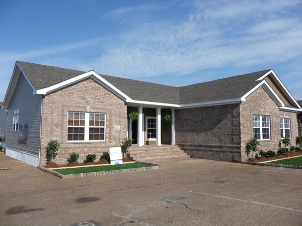 A nice looking manufactured home with a faux brick exterior