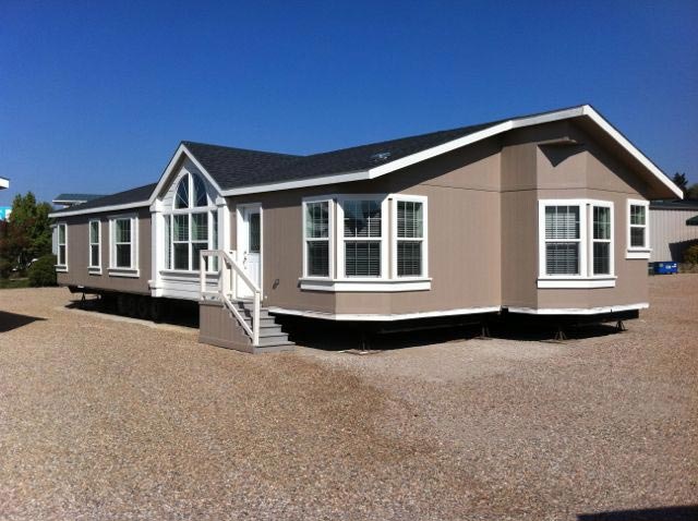 A manufactured home on a gravel lot